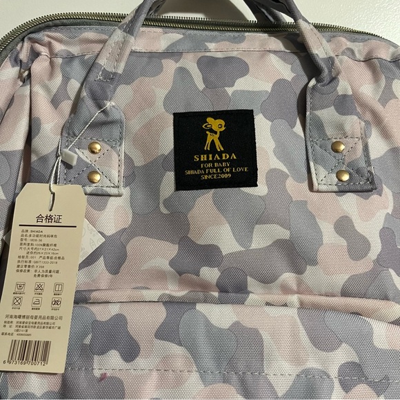 Shiada brand diaper bag backpack with a camouflage pattern in grey, pink, &white - Picture 4 of 15